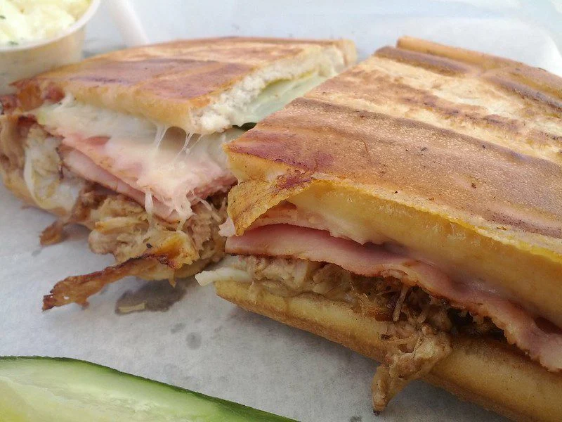 Cuban sandwich on a plate with pickle