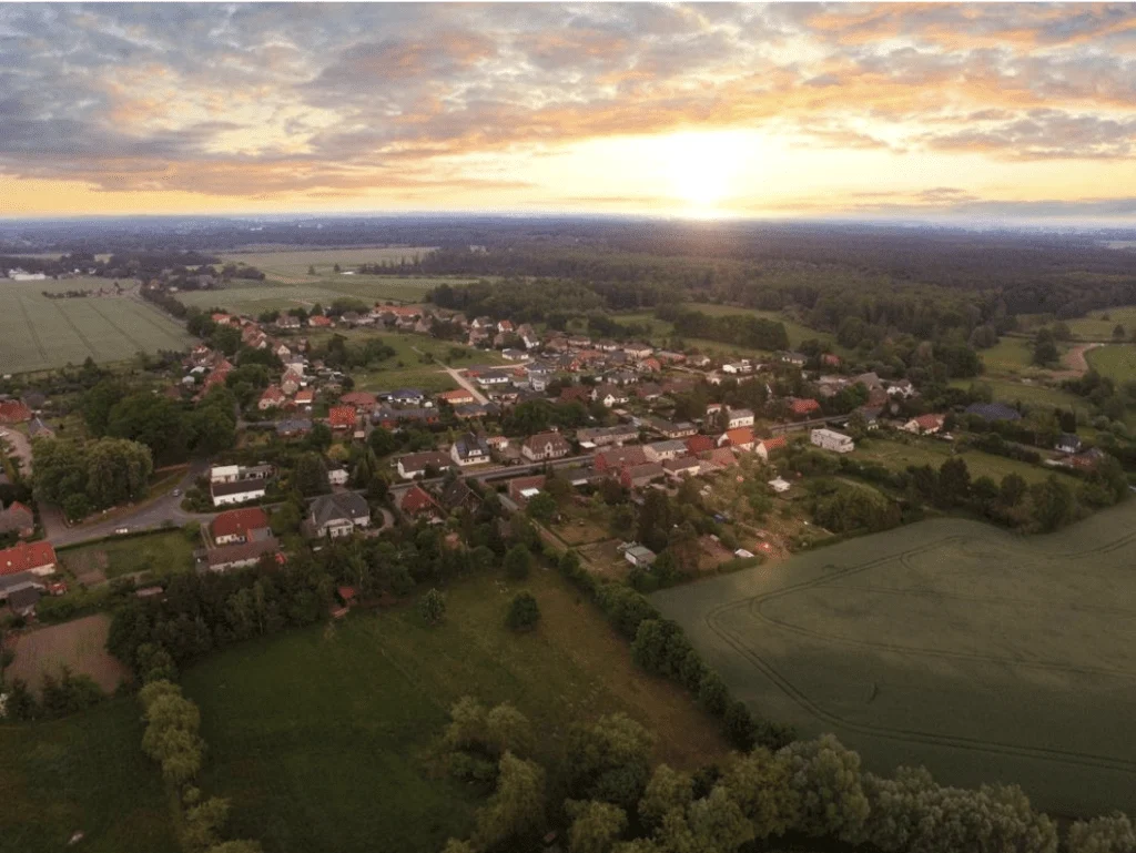 ariel shot of rural town at sundown