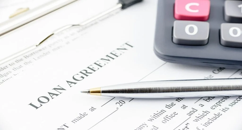 Loan agreement signing papers