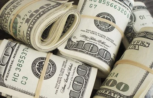 $100 bills wrapped in rubber bands